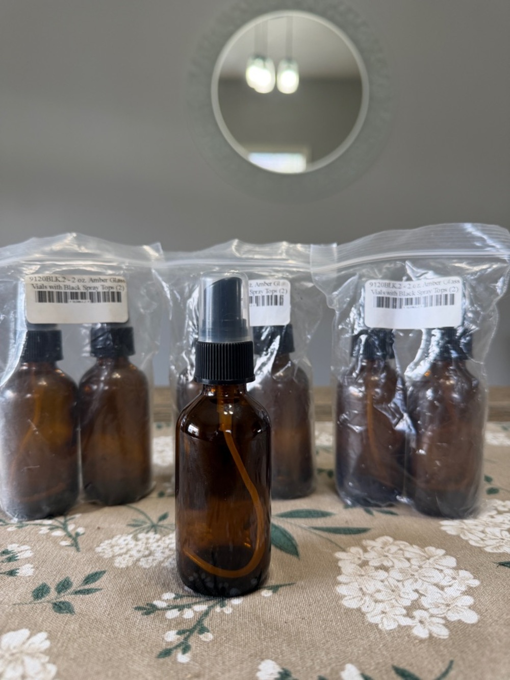 2 oz Amber Glass Spray Bottle with Black Mist Pump - Refillable Set of 7